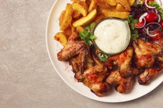 Fried chicken wings, with potatoes, and spices, homemade, fast food, no people