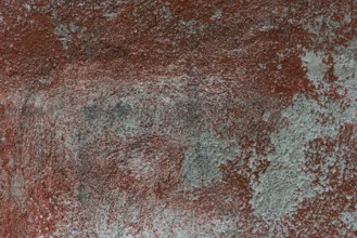 Texture of a stone wall, rough, stone, background, painted, colour, ochre, brown, worn,