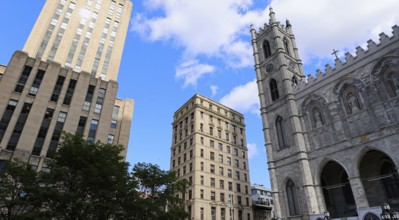 Place d'Armes square and Notre-Dame Basilica in Old Montreal historic town near Old Port