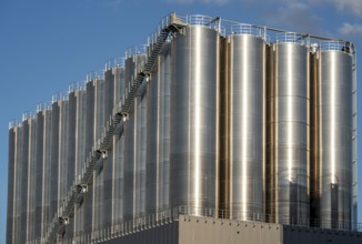 Stainless steel tanks of a large silo facility in Duisburg inland harbour, Duisburg-Neuenkamp, for