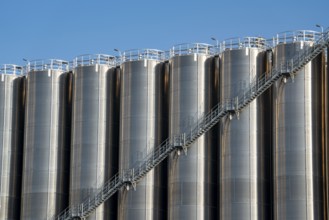 Stainless steel tanks of a large silo facility in Duisburg inland harbour, Duisburg-Neuenkamp, for