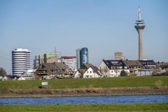 The skyline of Düsseldorf, with the skyscrapers in the Media Harbour, Rhine Tower, in front