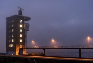 Thick fog in winter, hanging over the mouth of the Elbe into the North Sea, radar tower of the