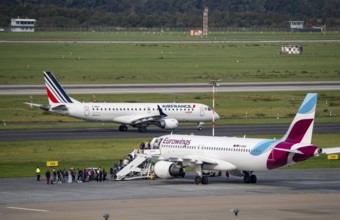 Düsseldorf Airport, Airfrance Hop Embraer ERJ-190 on the taxiway, Eurowings Airbus A320-200 at an