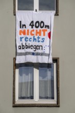 Poster on a residential building during the demonstration against the AFD party conference in