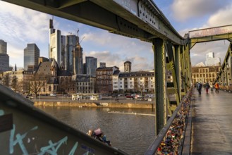 Skyline of the city centre of Frankfurt am Main, river Main, Eiserner Steg bridge, dusk, Hesse,