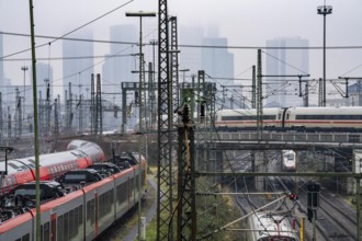 Railway tracks with regional and long-distance trains, ICE, after freezing rain, in front of