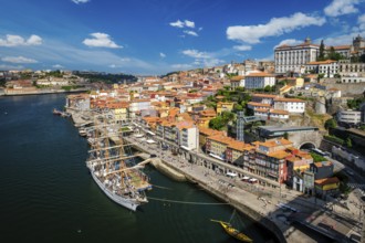 Aerial view of Porto city and Douro river with moored sailling ship from Dom Luis bridge I. Porto,