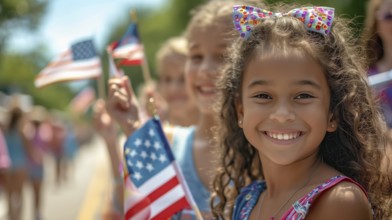 Cute african american girl celebrating the american holiday with friends and family at the parade.