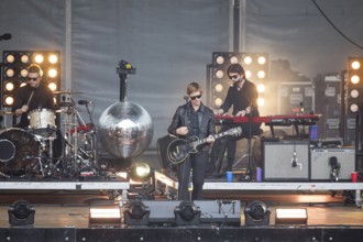 Samuel Sam Fogarino (drummer), Paul Banks (singer) and Brandon Curtis (keyboarder) of the band