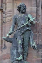 Sculpture Ironworker with anvil and hammer as a symbol for ironworks, statue, figure, bronze,