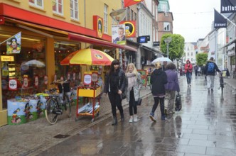 People in rain on pedestrian street in Aalborg, Jutland, Denmark, Scandinavia, Europe