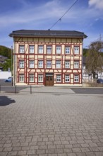 Half-timbered house against blue sky with cirrus clouds in Adenau, Eifel, district of Ahrweiler,