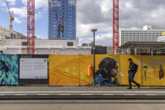 Construction site, construction fence and crane at Alexanderplatz in Berlin, Germany, Europe