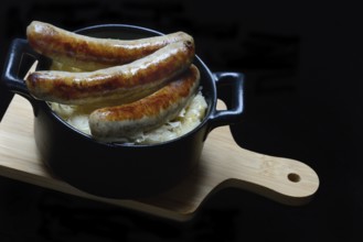 Nuremberg sausages with sauerkraut in a pot, Rostbratwurst, Germany, Europe