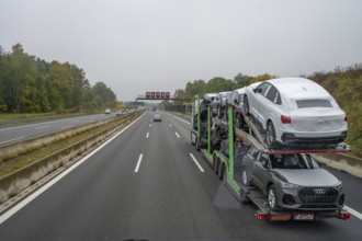 Car transporter with new cars on the A6 motorway, Bavaria, Germany, Europe