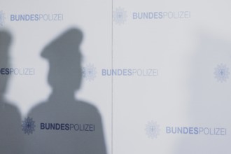 The shadow of a policewoman, taken as part of a press statement on the occasion of the opening of