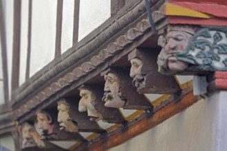 Seven envious heads on the historic House of the Seven Vices built in 1567, symbol, allegory, wood