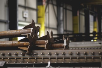 Steel parts that are to be galvanised lie in the factory hall of the surface finishing company