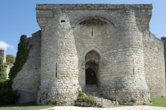 Billy. The entrance to a historic fortified castle, showcases medieval architecture from the 13th