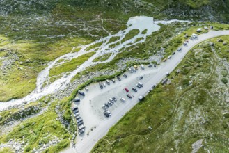 Parking lot at glacial lake Lac de Chateaupre, lake just below the Moiry glacier, camper vans,