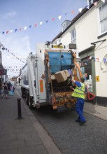 Refuse recycling vehicle in the streets of the town of Woodbridge, Suffolk, England, United