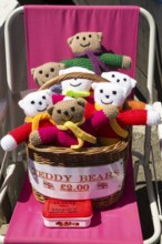 Homemade woollen teddy bears for sale with honesty money box, Cornwall, England, UK