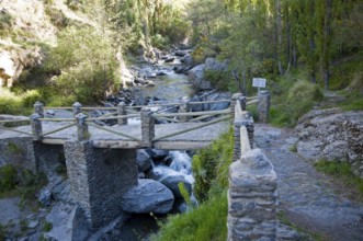 Bridge crossing the River Rio Poqueira gorge valley, High Alpujarras, Sierra Nevada, Granada