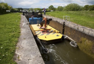 Maintenance boat at Caen Hill flight of locks on the Kennet and Avon canal Devizes, Wiltshire,