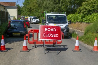 Road Closed sign due to BT maintenance work in street, Shottisham, Suffolk, England, UK