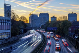 Evening traffic, partly with traffic jams, slow-moving traffic on the A40 motorway, skyline of