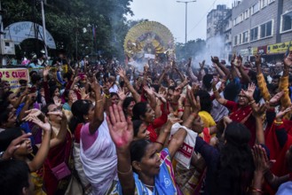 Devotees take part on a foot-march on the occasion of Vijay Dashmi, in Guwahati, Assam, India on