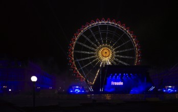 Night shot, rehearsal for New Year's Eve party, theatre, laser show, light show, Ferris wheel,