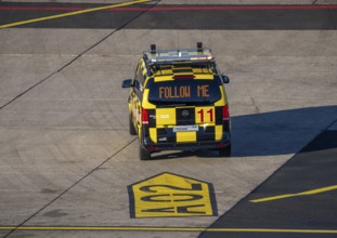 Follow Me vehicle, pilot vehicle, apron supervisor, marshal, directs an aircraft to its parking