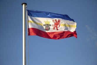 Waving flag of Mecklenburg-Vorpommern, blue sky, Germany, Europe