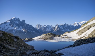 Mountain landscape in the morning light with mountain lake Lac Blanc, mountain peaks Grandes