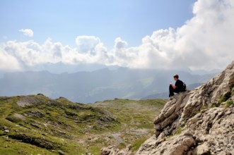 Ten-year-old boy hiking, short rest, Nebelhorn, Allgäu Alps, Bavaria, Germany, Europe