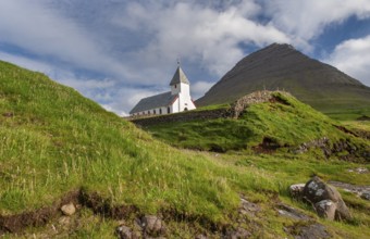 Church in front of a mountain backdrop, Malinsfjall mountain, Vidareidi, Vidoy island, Viðareiði,