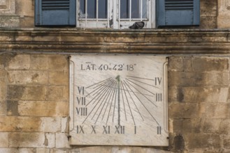 Sundial on a weathered house facade, Martina Franca, Apulia, Italy, Europe