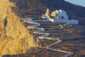 View of Panagia Kimissis church built on a cliff above the sea, Chora, Folegandros Island, Cyclades