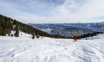 Ski tourers climbing Simetsberg, view of Walchensee, Estergebirge, Bavarian Prealps, Bavaria