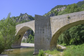 Old stone bridge over the Tarn River in Saint-Enimie, Département Lozère, France, Europe