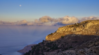 Coastal landscape with moonset and fascinating cloud formations, Morning mountain landscape,