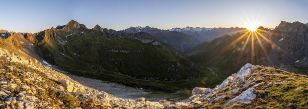 Panorama, mountain landscape at sunrise with sun star, view of mountain peaks of the Venediger