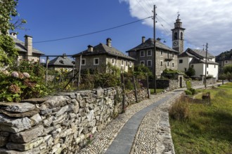 View of the village, typical Ticino stone houses in the mountain village of Rasa, Centovalli,