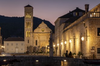 Illuminated historical buildings with church tower and morning atmosphere, Hvar, Croatia, Europe