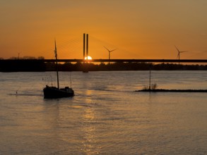 Sunset over river Rhine Lower Rhine, on the left in the foreground anchored historical ship