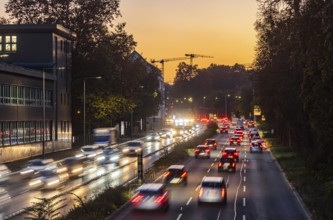 City centre street with heavy traffic in the evening. Dynamic light trails with long exposure time.