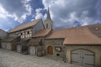 Inner courtyard with former so-called church arcades, barns in the historic fortified church,