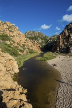 Red rocks and picturesque beach, Spiaggia di Cala li Cossi, Costa Paradiso, Sardinia, Italy, Europe